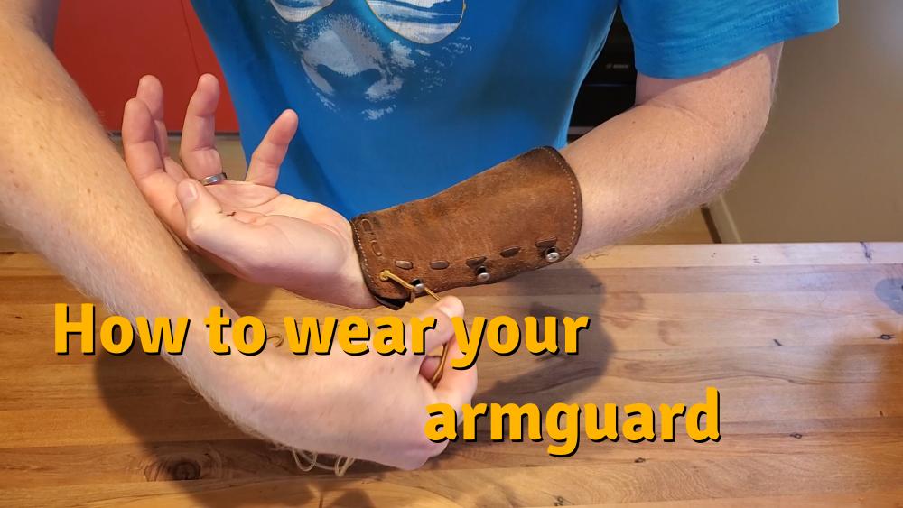 how to wear a leather armguard with a bungee cord